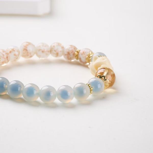 The Metal Element: White Lotus & Gold Blessing Charm Bracelet